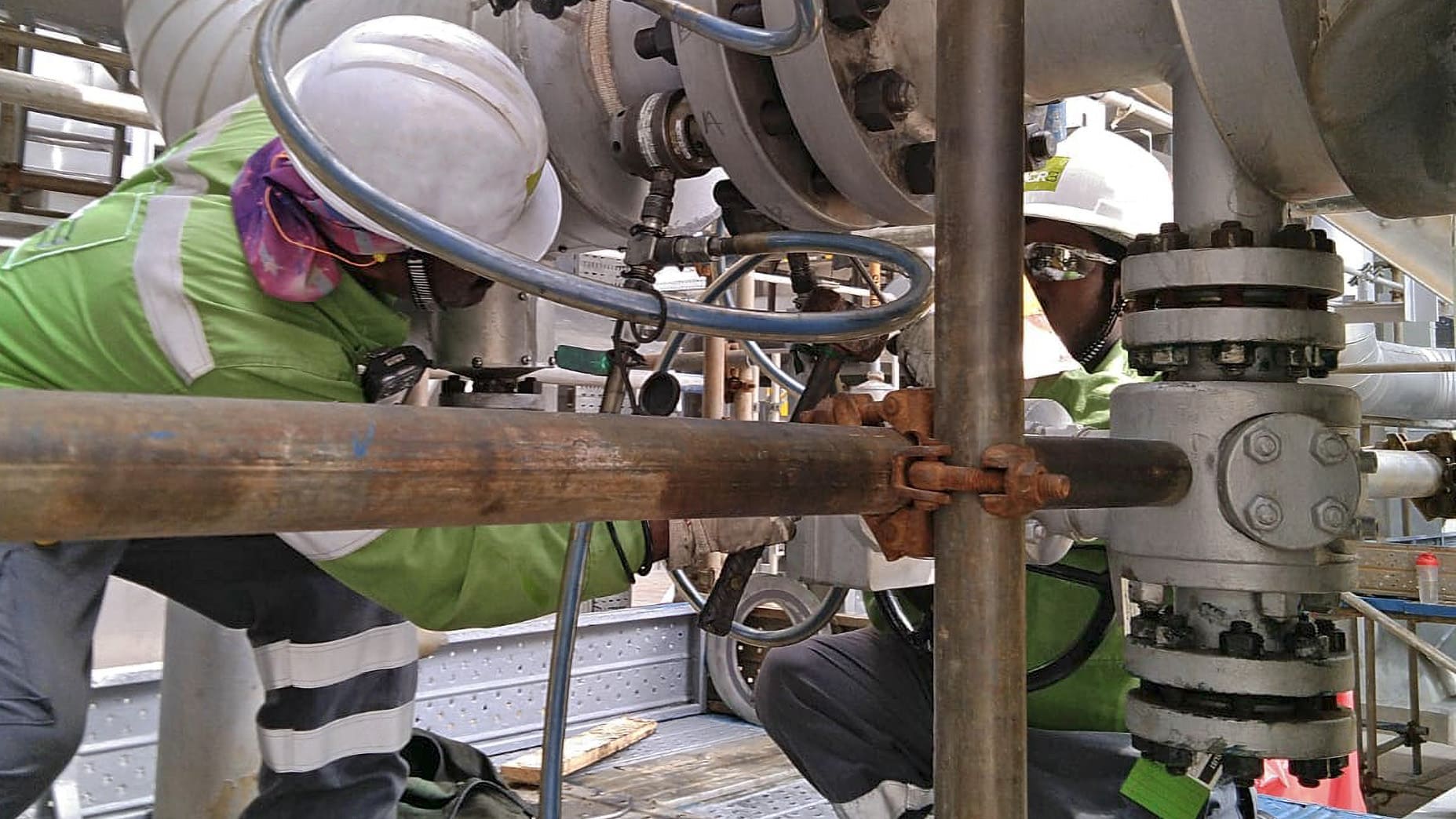 Two workers from CR3 working on a pipeline