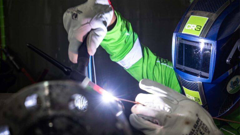 A CR# Technician welding