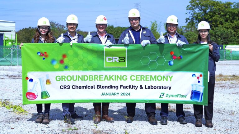 CR3 Team holding a banner explaining about the groundbreaking ceremony